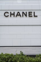 Chanel fashion store logo displayed in a fashionable shopping district of Bangkok, Thailand