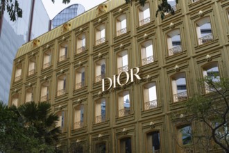 Dior designer fashion logo displayed on the flagship store in a fashionable shopping district of