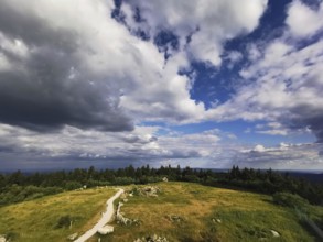 A wide view of the Schneeberg with a hiking trail under a big, blue sky, Franconian mountain trail,