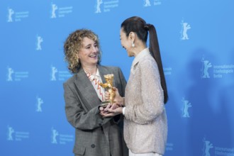 Tricia Tuttle (Artistic Director of the Berlinale) and Michelle Yeoh with the Golden Bear at the