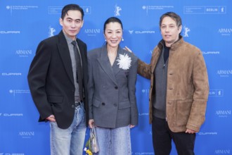 Hang Chong, Michelle Yeoh and Sean Baker in front of the premiere of the film Everything Everywhere