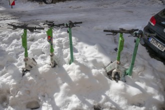 Parked, snow-covered scooters, Nuremberg, Middle Franconia, Bavaria, Germany