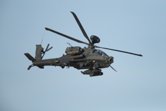 Hughes McDonnell Douglas Boeing AH-64 Apache helicopter of the British Army air corps flying in a