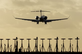 Gulfstream executive business jet aircraft in flight on approach to land at sunset at London