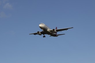 Airbus A320 commercial passenger airliner jet aircraft of Electra airlines flying on approach to
