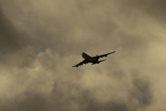 Boeing 747-400 jumbo jet LX-TCV commercial aircraft of Cargolux cargo in flight silhouette at