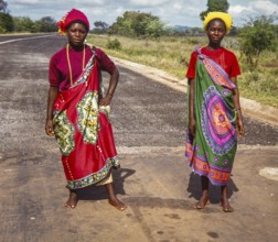 Two women in vibrant traditional Swazi or Zulu attire, showcasing the rich cultural heritage and