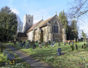 Village parish church of Saint Mary, Martlesham, Suffolk, England, UK and its rural churchyard with