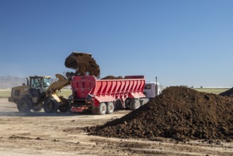 Buckeye, Arizona - Fresh soil is spread on a farm in the Arizona desert