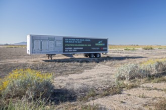Buckeye, Arizona - An advertisement on a parked semi-trailer offers land for sale for housing