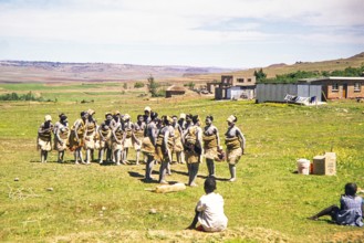 Basotho women dancers in traditional attire practice a performance in a rural area, South Africa,