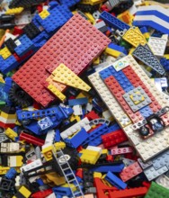 Assortment of unsorted Lego building bricks and construction items, children's toys, UK