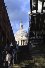 London, UK. January 31st 2025. A stylish man poses for a photo on the steps of the Thames