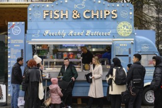 A blue retro Citroen food truck selling traditional British fish and chips on the south bank of the