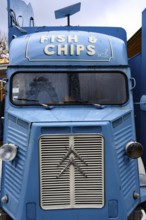 A blue retro Citroen food truck selling traditional British fish and chips on the south bank of the