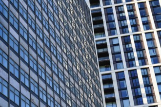 Abstract modern glass fronted designed offices and apartment buildings, high rise property in