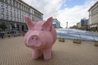 Sofia, Bulgaria. November 23rd 2025. A mock pink piggy bank instillation as a visual protest