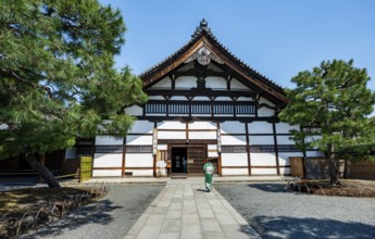 Japanese woman dressed in kimono in front of Kenninji Hombo, Kennin-ji Buddhist Temple,