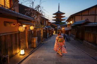 Japanese woman wearing kimono in an alley, Yasaka dori historic alleyway in the old town with