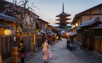 Japanese woman in kimono in an alley, Yasaka dori historic alleyway in the old town with