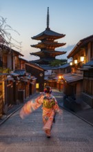 Japanese woman wearing kimono in an alley, Yasaka dori historic alleyway in the old town with