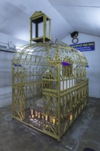 Tomb of Hasidic Rabbi Elimelech in a gilded grid at the Lezajsk Jewish Cemetery, Poland