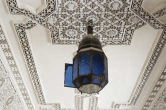 Lamp and stucco ceiling, Souk, Marrakech, Morocco