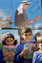 Latakia Countryside, Syria. October 18th 2010 Syrian schoolchildren collecting books from a mobile