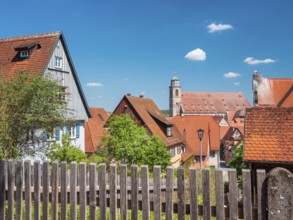 View over wooden fence to the houses in the historic old town and St. Georg Cathedral, on the right