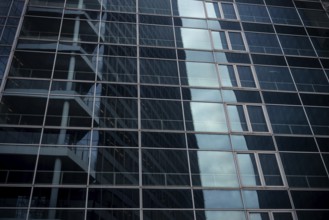 Abstract architecture of a glass fronted office building in a Paris commercial and financial