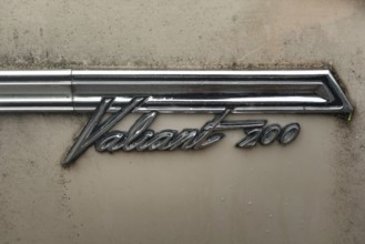 Rhine Falls, Switzerland. 26th September 2024 Badge of a Plymouth Valiant 200 four-door sedan car,