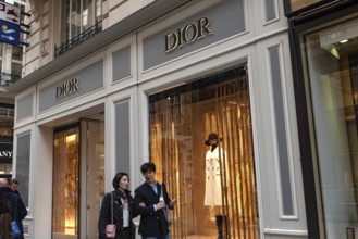 Vienna, Austria. October 15th 2024 Shoppers outside Dior shop, luxury fashion brand in central