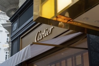 Vienna, Austria. October 15th 2024 Cartier logo and brand sign displayed on a Vienna store front,