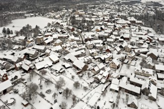 Winter aerial view of a snowy village with half-timbered houses, Herleshausen in northern Hesse
