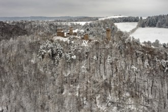 Wide view of a ruin in a wintry forest with snow-covered hills, The Brandenburg in the Werra Valley