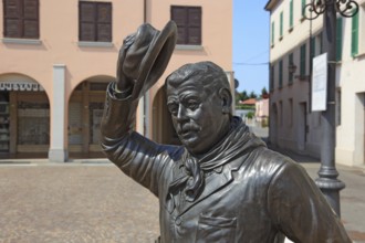 Italy, village of Brescello, bronze figure of Peppone, Mayor Giuseppe Bottazzi portrayed by actor
