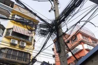 Bangkok, Thailand. March 4th 2025. A tangled mess of cables and wires used for phone and internet