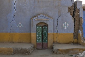 Aswan, Egypt. December 10th 2022 Traditional brightly coloured painted Nubian house in a village on