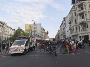 May Day, large crowd on Labor Day with bicycles and banners at an urban demonstration, Maidemo,