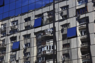Romania, capital city Bucharest, Bucuresti, reflection in a glass façade