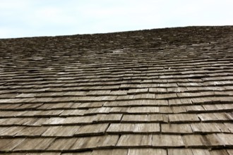 Close-up of a traditional wooden shingle roof, building materials, wood shingles