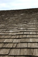 Close-up of a traditional wooden shingle roof, building materials, wood shingles