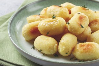 Stuffed gnocchi with cheese, Italian dumplings, garnished with parmesan cheese, no people