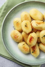 Stuffed gnocchi with cheese, Italian dumplings, garnished with parmesan cheese, no people