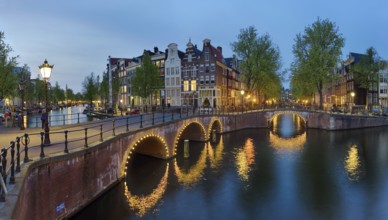 Canals illuminated panoramic night Amsterdam Netherlands