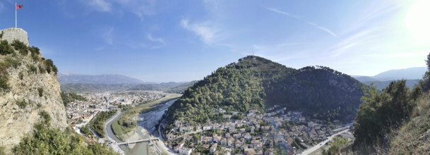 Panorama, panoramic view of a castle, including river and city, in a mountainous green landscape,