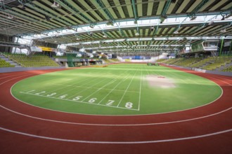 Round green running track with numbered markings in a sports hall, Glaspalast Sindelfingen,