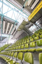 Yellow seats in a stand in a modern sports hall, Glaspalast Sindelfingen, Böblingen district,