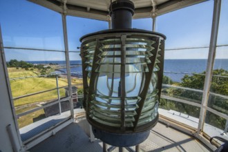 The lens of Smygehuk lighthouse and view towards Smygehamn in Trelleborg municipality, Baltic Sea,