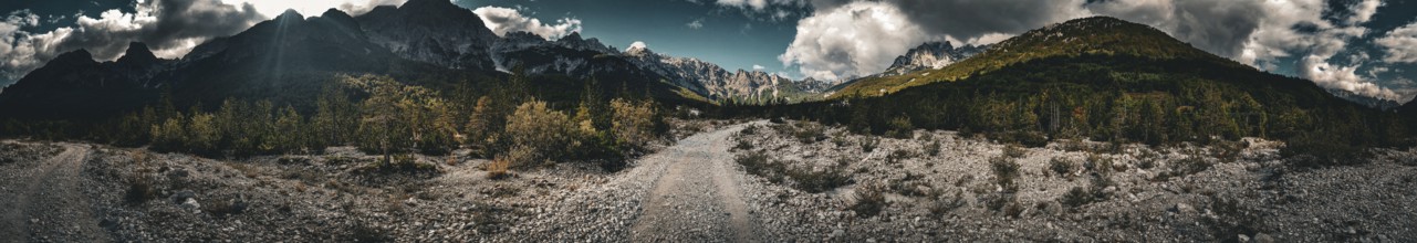 Dramatic panorama of a mountain landscape with contrasting lighting, Albanian Alps National Park
